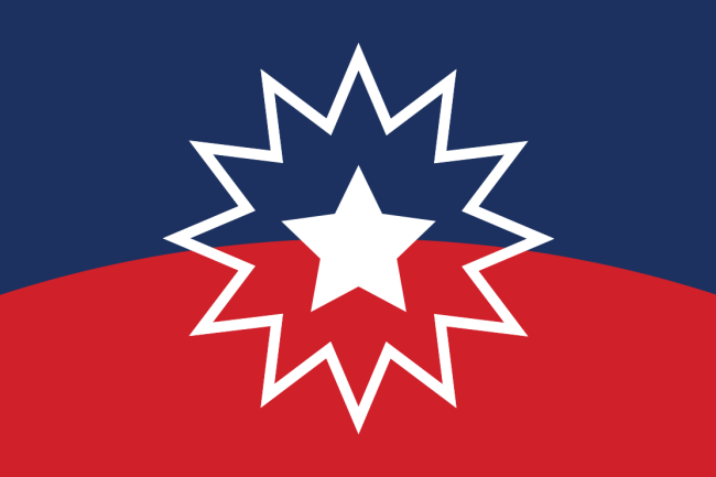 Juneteenth flag, a five point white star outlined by a 12 point starburst over a curved field of blue and red.